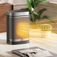 Radiador Dreo aquece escritório com computador portátil e planta