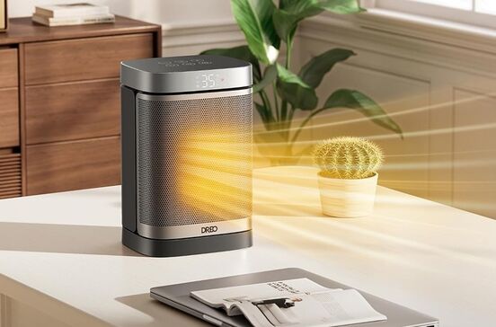 Radiador Dreo aquece escritório com computador portátil e planta