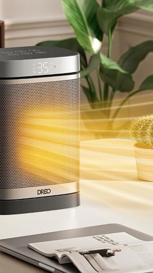 Radiador Dreo aquece escritório com computador portátil e planta