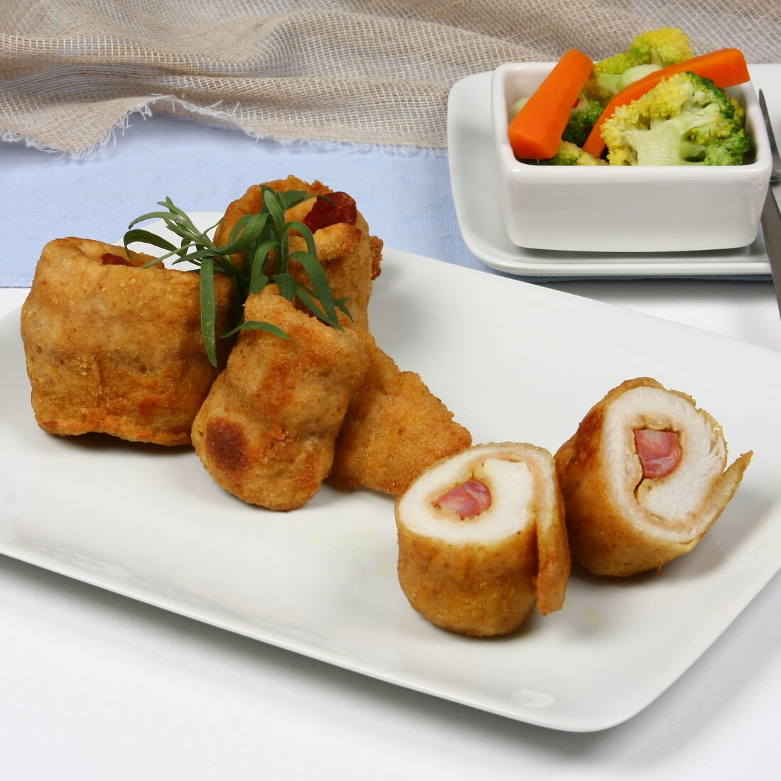 Rolinhos de peixe com legumes e fiambre