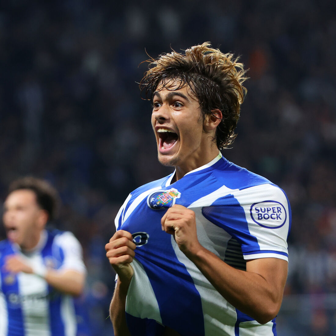Porto's Rodrigo Mora celebrates, with teammate Pepe at left, after scoring his side's second goal during the Europa League opening