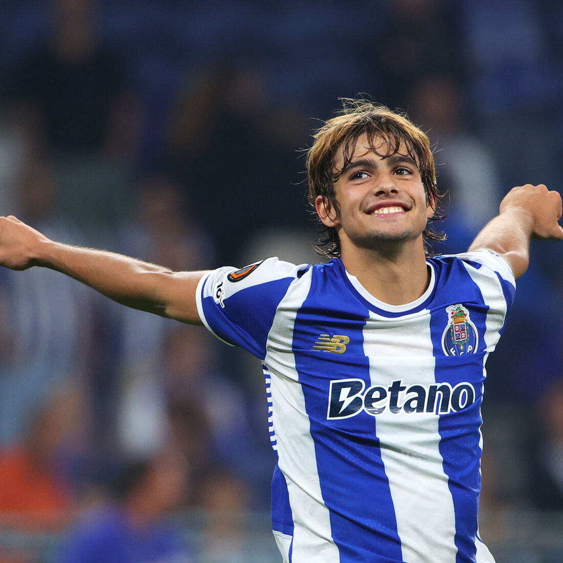 Porto's Rodrigo Mora celebrates at the end of the Europa League opening phase soccer match between FC Porto and Red