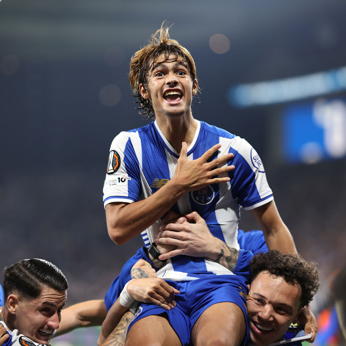 Porto's Rodrigo Mora celebrates on the shoulders of teammate Pepe after scoring his side's second goal during the Europa League